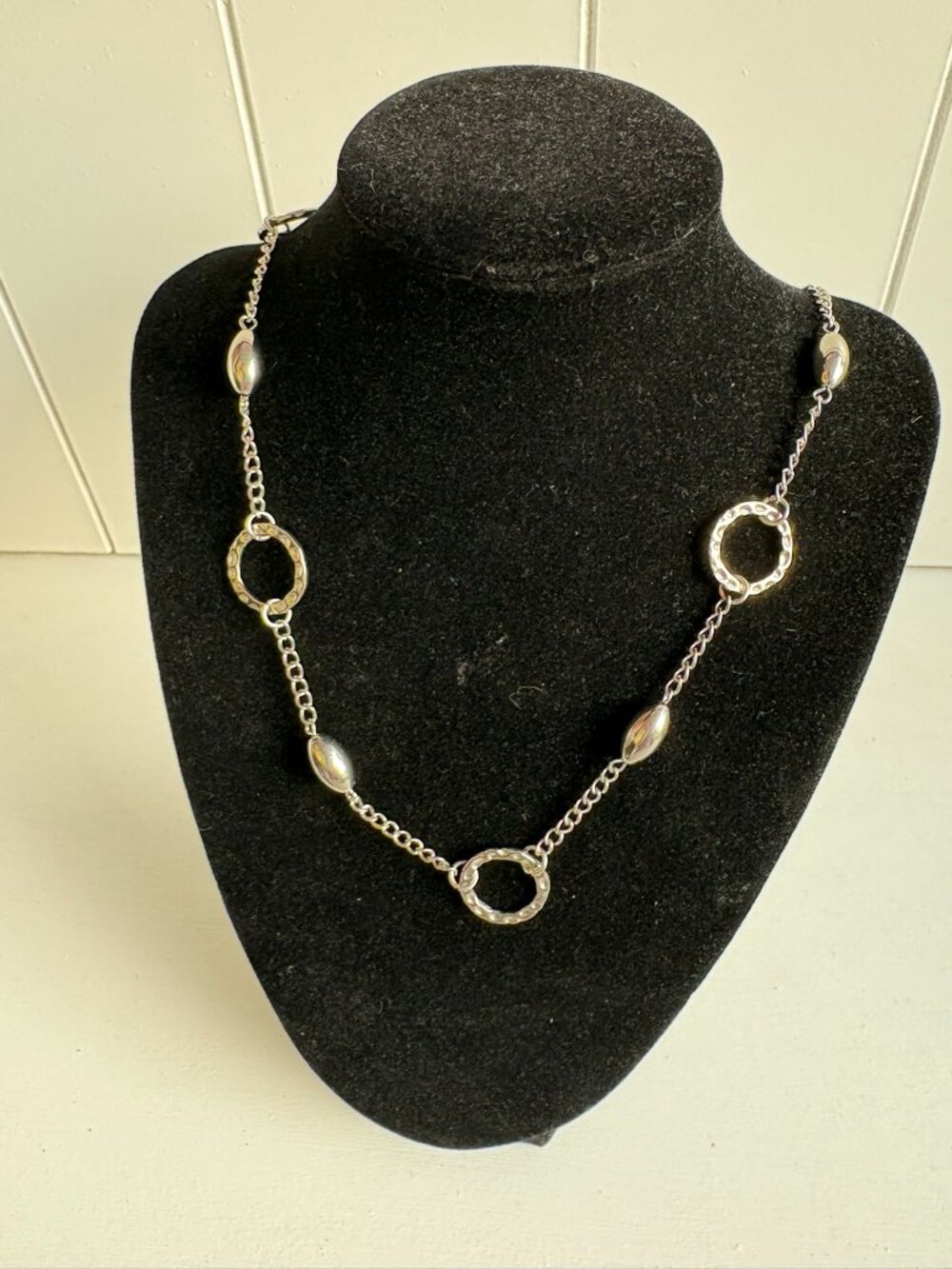 Silver necklace, measures 13" lying flat